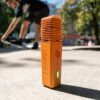 Veazy vaporizer storz and bickel inspiring orange sunshine skater in background