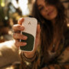 White AirVape Legacy Core with tan skin held in an outdoor setting