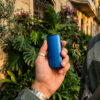 Person carrying the blue DaVinci IQ Core in an outdoor setting