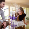 Purple Stündenglass Gravity Infuser being used in an indoor setting