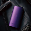 Purple DaVinci IQ Core displayed on a leather travel bag