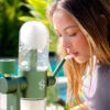 Green Stündenglass Gravity Infuser being used beside an outdoor pool