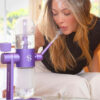 Close view of a woman using the purple Stündenglass Gravity Infuser