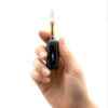 G Pen 510 OG battery and cartridge displayed upright in a person’s hand