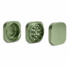 Greenstone PAX Grinder opened into three sections showing grinding teeth, chamber and lid