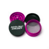 Pink Split Series Medium grinder separated to show the teeth, mesh screen and lower chamber